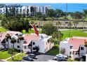 Overhead shot of a condominium complex showcasing well-maintained grounds and waterfront scenery at 5736 La Puerta Del Sol S Blvd # 254, St Petersburg, FL 33715