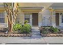Welcoming townhouse entrance with manicured landscaping and convenient access at 8531 Trail Wind Dr, Tampa, FL 33647