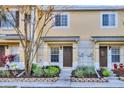 Inviting townhouse facade showcasing a well-kept garden and neutral color scheme at 8531 Trail Wind Dr, Tampa, FL 33647