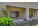 A cozy covered patio with sliding glass doors, ideal for outdoor relaxation at 8531 Trail Wind Dr, Tampa, FL 33647