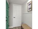 Inviting hallway featuring neutral tones, decorative wainscoting, and stylish decor at 12700 5Th Isle, Hudson, FL 34667