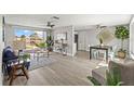 Bright and airy living room with stylish furnishings and a serene water view at 12700 5Th Isle, Hudson, FL 34667