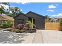 Charming modern home with striking black exterior, fresh landscaping, and a well-manicured front yard at 2429 1St N Ave, St Petersburg, FL 33713