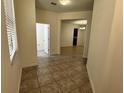 Open entryway featuring neutral colored tile flooring at 2731 Hampton Green Ln, Brandon, FL 33511