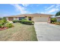 Charming single-story home with well-maintained landscaping and attached two car garage at 280 Fortaleza St, Punta Gorda, FL 33983