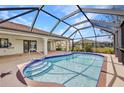 Screened-in pool with sun-shelf and patio, perfect for relaxation and entertainment at 280 Fortaleza St, Punta Gorda, FL 33983