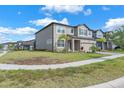 Beautiful two-story home with a well-maintained lawn and inviting curb appeal in a desirable neighborhood at 3113 Marine Grass Dr, Wimauma, FL 33598