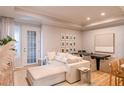 Bright living room featuring hardwood floors, recessed lighting, and a comfortable couch and dining area at 4221 W Spruce St # 2422, Tampa, FL 33607