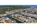 Expansive waterfront community showcases numerous homes nestled along winding canals leading out to the open bay at 4920 Pelican Dr, New Port Richey, FL 34652