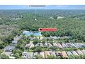 Picturesque aerial shot showcases the home near conservation land and a tranquil lake at 5607 Tanagergrove Way, Lithia, FL 33547