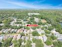 Expansive aerial view of the Tanagergrove neighborhood with lush greenery and beautiful homes at 5607 Tanagergrove Way, Lithia, FL 33547