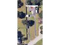 Overhead view of the house highlighting the lot and driveway, within a green landscaped community at 620 Lithia Pinecrest Rd, Brandon, FL 33511