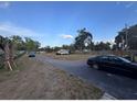 Wide street view of the home, showcasing its setting within a peaceful neighborhood at 620 Lithia Pinecrest Rd, Brandon, FL 33511