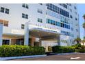 Welcoming entrance to Sky Harbour with well maintained landscaping and covered portico at 7200 Sunshine Skyway S Ln # 4B, St Petersburg, FL 33711
