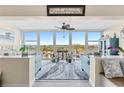 Cozy living room with large windows offering scenic views and comfortable seating at 7200 Sunshine Skyway S Ln # 4B, St Petersburg, FL 33711