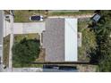 Overhead view of a well-maintained home featuring a combination roof and large backyard at 8497 137Th St, Seminole, FL 33776