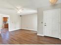 Inviting living room featuring wood flooring and an abundance of natural light, complete with a ceiling fan at 8520 Woodall Ct, Tampa, FL 33615