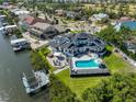 A stunning waterfront property with pool, patio, and dock, offering serene outdoor living at 945 Bunker View Dr, Apollo Beach, FL 33572
