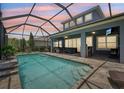 Relaxing screened-in pool area with ample seating, perfect for entertaining or enjoying a quiet afternoon at 14319 Rolling Dune Rd, Lithia, FL 33547