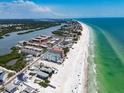 Expansive aerial view of waterfront community near the beach, perfect for coastal living at 19727 Gulf Blvd # 210, Indian Shores, FL 33785