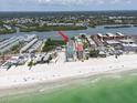 Panoramic aerial view of the waterfront community, beach and bay, highlighting the condo location at 19727 Gulf Blvd # 210, Indian Shores, FL 33785