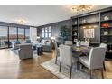 Well-lit living space with hardwood floors, stylish seating, and access to a balcony with city views at 199 Dali Blvd # 902, St Petersburg, FL 33701