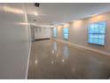 Expansive living room with large windows providing ample natural light at 2904 W Marlin Ave, Tampa, FL 33611
