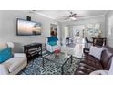 Cozy living room featuring comfortable seating, modern decor, and easy access to the backyard patio at 3005 W Helen Ave, Tampa, FL 33611