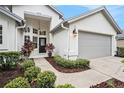 Inviting front exterior featuring a well-maintained lawn and an attached two-car garage at 3023 Bent Creek Dr, Valrico, FL 33596