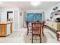 Inviting dining area with sliding glass doors offering natural light and access to the outdoors at 3078 Pointer Dr, Palm Harbor, FL 34683