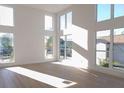 Bright and airy living room with lots of natural light and neutral-toned flooring at 3820 Pompano Se Dr, St Petersburg, FL 33705