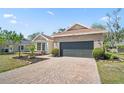 Beautiful single-story home featuring a two-car garage, brick accents, and meticulous landscaping at 4317 74Th E Ave, Sarasota, FL 34243