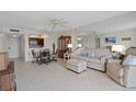 Comfortable living room with an adjacent dining area and kitchen, perfect for entertaining and everyday living at 4900 Brittany S Dr # 808, St Petersburg, FL 33715