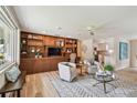 Spacious living room features custom built-ins, hardwood floors, and a stylish seating area at 5055 29Th S St, St Petersburg, FL 33712