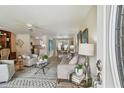 Bright and welcoming living room featuring stylish decor, an elegant rug, and lots of natural light at 5055 29Th S St, St Petersburg, FL 33712