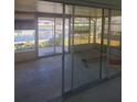 Enclosed sunroom with sliding glass doors that have canal views at 5105 Bonito Dr, New Port Richey, FL 34652