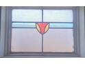 Close-up of a window featuring decorative stained glass at 5105 Bonito Dr, New Port Richey, FL 34652