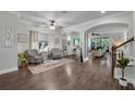 Spacious living room with hardwood floors, comfortable seating, and an open layout for modern living at 5910 Caldera Ridge Dr, Lithia, FL 33547