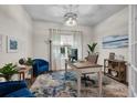 Bright home office with a large desk, comfortable seating, stylish decor, and ample natural light at 5910 Caldera Ridge Dr, Lithia, FL 33547