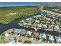 Breathtaking aerial view of the beautiful waterfront community showcasing a home with canal access and stunning water views at 715 Pinckney Dr, Apollo Beach, FL 33572