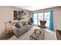 Cozy living room featuring stylish decor, a comfortable sofa, and a large window with bright blue curtains at 8014 N Lynn Ave, Tampa, FL 33604