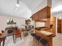 Inviting living space with a kitchen bar and stylishly decorated dining and living areas at 8014 N Lynn Ave, Tampa, FL 33604
