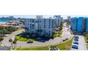Well-maintained condo building with manicured lawns, mature trees and conveniently located near local beaches at 855 Bayway Blvd # 703, Clearwater Beach, FL 33767