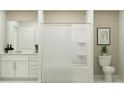 This bathroom features a sleek vanity and a shower-tub combination at 10210 Purple Leaf Ct, Riverview, FL 33578
