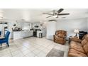 Open-concept kitchen featuring sleek appliances and tiled flooring at 10737 Scenic Dr, Port Richey, FL 34668