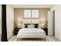 Inviting bedroom with neutral tones, a plush bed, and stylish decor at 15262 Rainbow Quartz St, Wimauma, FL 33598