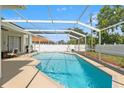 Enjoy this screened-in pool area perfect for relaxing, swimming, and outdoor entertainment on a sunny day at 15428 Atwater Dr, Brooksville, FL 34604
