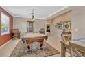 Spacious game room showcasing a pool table, decor, and seating at 15635 Starling Water, Lithia, FL 33547