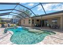 Screened-in pool with a tanning deck, outdoor seating, and a relaxing backyard at 15635 Starling Water, Lithia, FL 33547