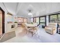 Bright sunroom features tile floors and a fireplace, ideal for year-round enjoyment at 20 Windrush Bay Dr # 20, Tarpon Springs, FL 34689